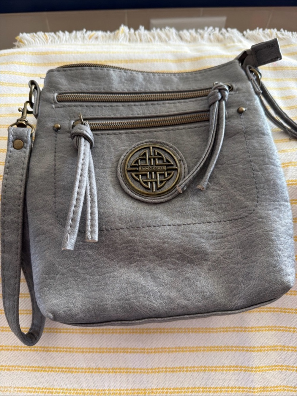 Stone & Co. Slate Gray Crossbody Bag with Tassel and Medallion